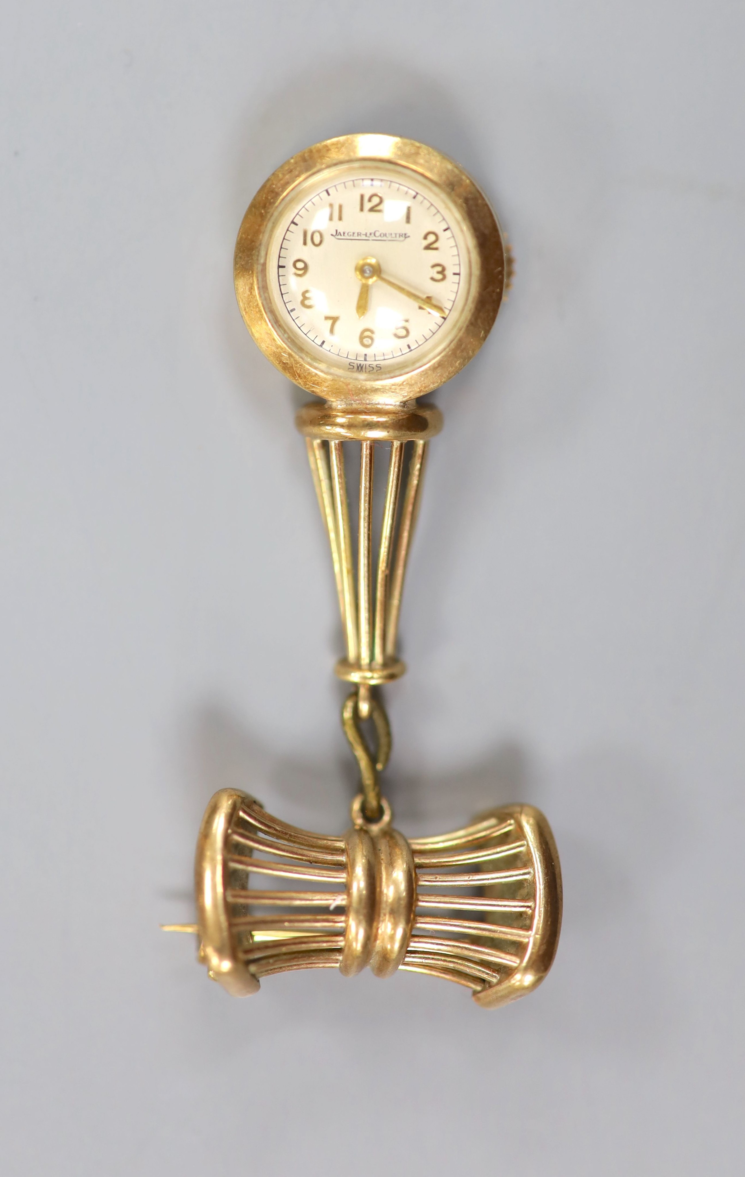 A lady's 9ct gold Jaeger LeCoultre manual back wind pendant watch on a 9ct gold suspension brooch, overall 50mm, gross weight 13.3 grams, case diameter 16mm, in fitted Jaeger LeCoultre box.